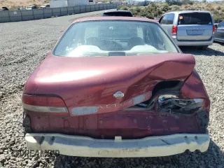 1995 Nissan Altima XE z VIN 1N4BU31D8SC164328, wystawiony jako Copart lot #65999624 z przebiegiem 196 247 mil mil oraz Szkoda całkowita • Salvage title. Historia ofert i sprzedaży dostępna na DreamBid. Obrazek 6.