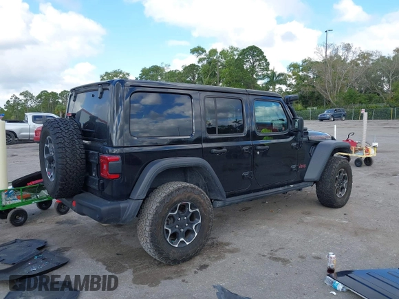 2023 Jeep Wrangler Rubicon with VIN 1C4HJXFGXPW534515, listed as a IAAI auction lot 41524419 with 21,376 mi miles and . Bid and sale history available at DreamBid. Image 4.