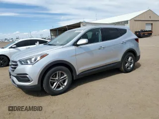 2018 Hyundai Santa Fe 2.4L z VIN 5XYZTDLBXJG511715, wystawiony jako Copart lot #58163865 z przebiegiem 56 782 mil mil oraz Szkoda całkowita • Salvage title. Historia ofert i sprzedaży dostępna na DreamBid. Obrazek 1.