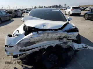 2021 Tesla Model 3 Performance z VIN 5YJ3E1EC1MF075451, wystawiony jako Copart lot #60354235 z przebiegiem 52 662 mil mil oraz Szkoda całkowita • Salvage title. Historia ofert i sprzedaży dostępna na DreamBid. Obrazek 5.