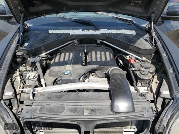 2012 BMW X5 35i with VIN 5UXZV4C54CL744502, listed as a Copart auction lot 57828115 with 161,597 mi miles and Clean title. Bid and sale history available at DreamBid. Image 12.