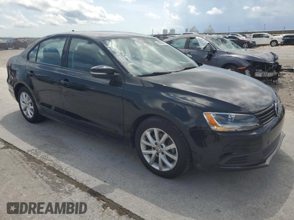 2012 Volkswagen Jetta SE with VIN 3VWDX7AJ3CM338441, listed as a Copart auction lot 60853055 with 151,075 mi miles and Salvage title. Bid and sale history available at DreamBid. Image 4.
