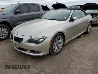 2009 BMW 6 Series 650i with VIN WBAEB53599CX64829, listed as a Copart auction lot 75694824 with 0 mi miles and Salvage Title. Bid and sale history available at carsss.com. Image 1.