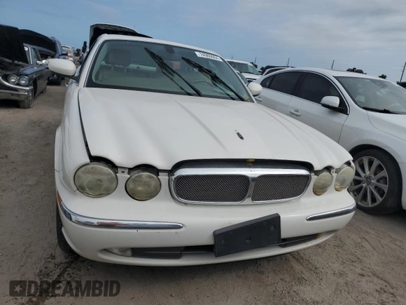 2004 Jaguar XJ with VIN SAJWA71C44SG34094, listed as a Copart auction lot 74969004 with 0 mi miles and Salvage Title. Bid and sale history available at carsss.com. Image 5.