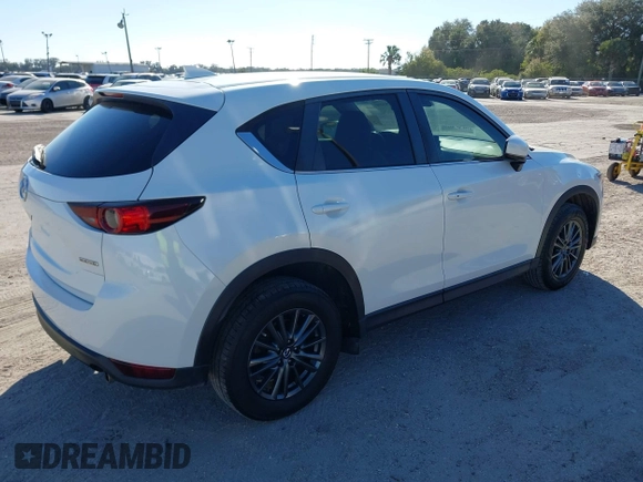 2020 Mazda CX-5 Touring with VIN JM3KFACM6L0737727, listed as a IAAI auction lot 41283200 with 85,949 mi miles and . Bid and sale history available at carsss.com. Image 4.