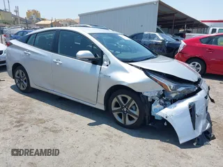 2019 Toyota Prius L Eco z VIN JTDKARFU0K3102629, wystawiony jako IAAI lot #42458733 z przebiegiem 21 145 mil mil oraz . Historia ofert i sprzedaży dostępna na DreamBid. Obrazek 1.