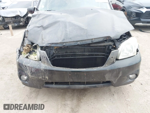 2005 Mazda Tribute S with VIN 4F2YZ96145KM32776, listed as a IAAI auction lot 42159162 with 200,416 mi miles and . Bid and sale history available at DreamBid. Image 6.