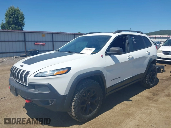 2014 Jeep Cherokee Trailhawk with VIN 1C4PJMBSXEW236807, listed as a IAAI auction lot 42660980 with 157,225 mi miles and . Bid and sale history available at DreamBid. Image 21.