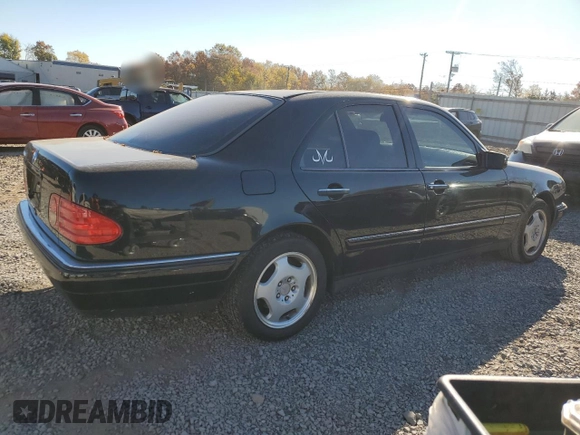 1997 Mercedes-Benz E-Class with VIN WDBJF72F0VA523161, listed as a Copart auction lot 77752804 with 143,495 mi miles and Salvage Title. Bid and sale history available at carsss.com. Image 3.