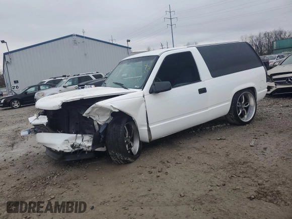 1997 GMC Yukon with VIN 3GKEC18R0VG523581, listed as a Copart auction lot 79601454 with 184,548 mi miles and Salvage Title. Bid and sale history available at carsss.com. Image 1.