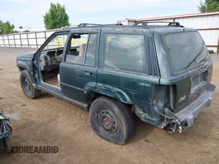 1994 Jeep Grand Cherokee Laredo with VIN 1J4GZ58S9RC215874, listed as a IAAI auction lot 42577378 with 230,824 mi miles and . Bid and sale history available at DreamBid. Image 3.