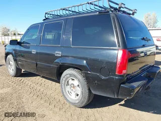1999 GMC Denali with VIN 1GKEK13R4XR904086, listed as a IAAI auction lot 42034848 with 169,847 mi miles. Bid and sale history available at carsss.com. Image 3.