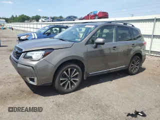 2017 Subaru Forester Touring with VIN JF2SJGWC9HH402713, listed as a Copart auction lot 62257345 with 128,903 mi miles and Salvage title. Bid and sale history available at DreamBid. Image 1.