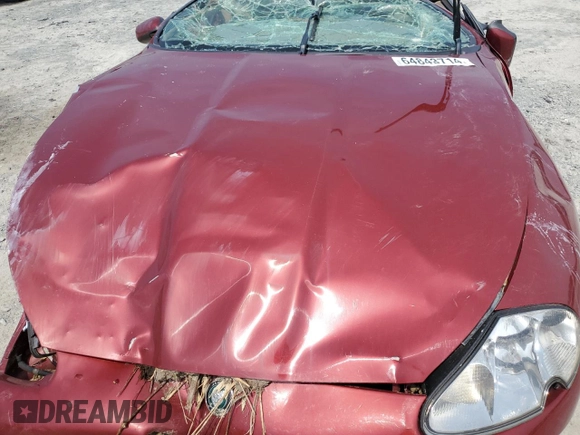 1999 Jaguar XK with VIN SAJGX204XXC038435, listed as a Copart auction lot 64843714 with Not Provided miles and Salvage Title. Bid and sale history available at DreamBid. Image 12.