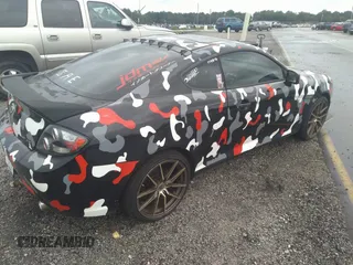 2008 Hyundai Tiburon GT z VIN KMHHN66F58U262230, wystawiony jako IAAI lot #33619963 z przebiegiem 150 708 mil mil oraz . Historia ofert i sprzedaży dostępna na DreamBid. Obrazek 4.