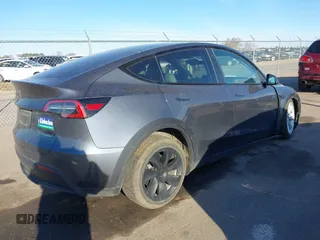 2023 Tesla Model Y Long Range with VIN 7SAYGAEEXPF714760, listed as a IAAI auction lot 41748398 with 49,802 mi miles and . Bid and sale history available at DreamBid. Image 4.