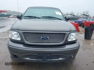2002 Ford F-150 Harley Davidson with VIN 1FTRW07392KD29874, listed as a IAAI auction lot 41974230 with 163,279 mi miles. Bid and sale history available at carsss.com. Image 12.