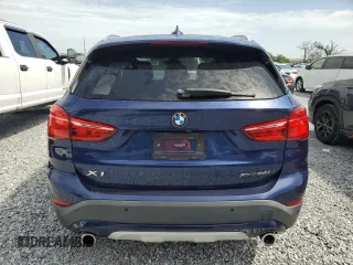 2020 BMW X1 xDrive28i with VIN WBXJG9C0XL5R33141, listed as a Copart auction lot 63040155 with 165,172 mi miles and Clean title. Bid and sale history available at DreamBid. Image 6.