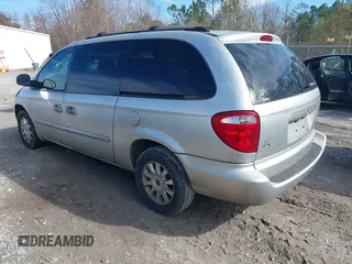 2003 Chrysler Town & Country LX with VIN 2C4GP44L03R203678, listed as a IAAI auction lot 41293296 with 210,827 mi miles and . Bid and sale history available at DreamBid. Image 3.