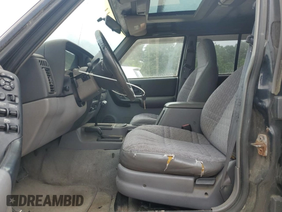 1998 Jeep Cherokee Sport z VIN 1J4FJ68S8WL183519, wystawiony jako Copart lot #60976335 z przebiegiem 161 536 mil mil oraz Czysty tytuł • Clean title. Historia ofert i sprzedaży dostępna na DreamBid. Obrazek 7.
