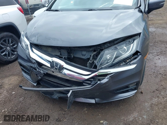 2018 Honda Odyssey EX-L z VIN 5FNRL6H74JB043276, wystawiony jako IAAI lot #42326742 z przebiegiem 126 025 mil mil oraz . Historia ofert i sprzedaży dostępna na DreamBid. Obrazek 6.