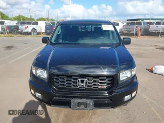 2013 Honda Ridgeline Sport with VIN 5FPYK1F70DB011814, listed as a IAAI auction lot 41689579 with 136,251 mi miles and . Bid and sale history available at DreamBid. Image 12.
