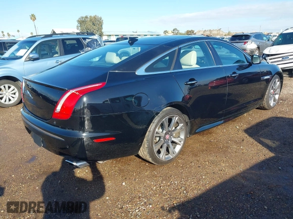 2015 Jaguar XJ with VIN SAJWA1CZ2F8V84677, listed as a IAAI auction lot 41723372 with 52,888 mi miles. Bid and sale history available at carsss.com. Image 4.