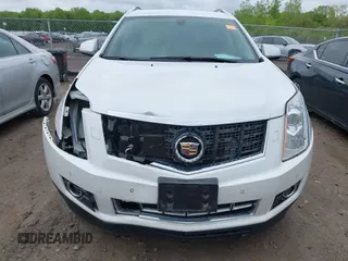 2014 Cadillac SRX Performance Collection with VIN 3GYFNCE34ES519059, listed as a IAAI auction lot 42237351 with 80,578 mi miles and . Bid and sale history available at DreamBid. Image 6.