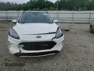 2020 Ford Escape Titanium z VIN 1FMCU9J9XLUB57675, wystawiony jako Copart lot #57777795 z przebiegiem Nie podano mil oraz Szkoda całkowita • Salvage title. Historia ofert i sprzedaży dostępna na DreamBid. Obrazek 14.
