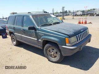 1994 Jeep Grand Cherokee Laredo with VIN 1J4GZ58S2RC118502, listed as a IAAI auction lot 42701778 with 420,559 mi miles and . Bid and sale history available at DreamBid. Image 1.