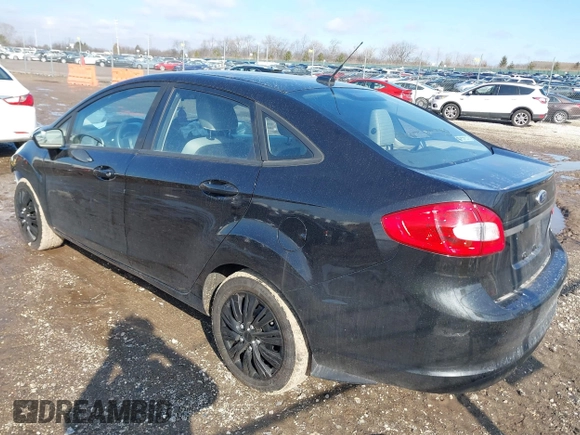 2013 Ford Fiesta S z VIN 3FADP4AJ2DM129703, wystawiony jako IAAI lot #41669041 z przebiegiem 138 831 mil mil oraz . Historia ofert i sprzedaży dostępna na DreamBid. Obrazek 3.