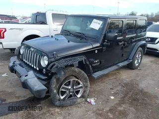 2016 Jeep Wrangler Unlimited 75th Anniversary with VIN 1C4BJWEG1GL221873, listed as a IAAI auction lot 41635788 with 148,493 mi miles. Bid and sale history available at carsss.com. Image 2.