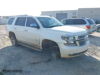 2015 Chevrolet Tahoe LTZ with VIN 1GNSCCKCXFR287609, listed as a IAAI auction lot 41688936 with 112,678 mi miles. Bid and sale history available at carsss.com. Image 1.