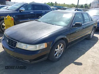 1998 Cadillac Seville STS z VIN 1G6KY5499WU916185, wystawiony jako IAAI lot #42035783 z przebiegiem 164 763 mil mil oraz . Historia ofert i sprzedaży dostępna na DreamBid. Obrazek 2.