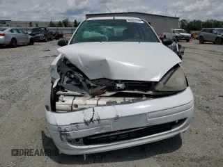 2003 Ford Focus ZX3 with VIN 3FAFP31383R117755, listed as a Copart auction lot 60668725 with 135,856 mi miles and Salvage title. Bid and sale history available at DreamBid. Image 5.