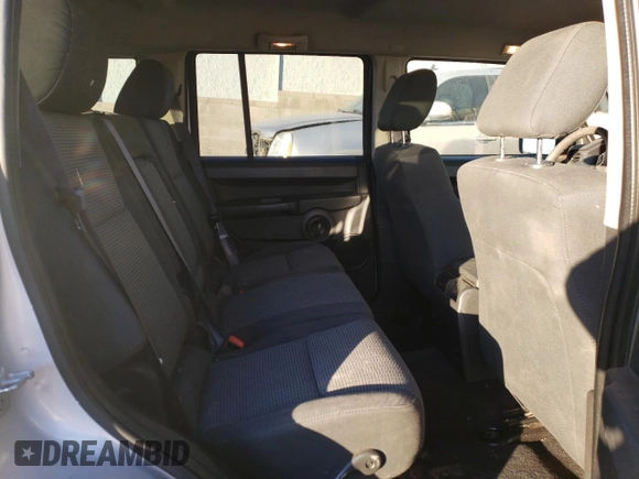 2008 Jeep Commander Sport z VIN 1J8HH48KX8C105432, wystawiony jako Copart lot #86000854 z przebiegiem 201 869 mil mil oraz Szkoda całkowita • Salvage title. Historia ofert i sprzedaży dostępna na DreamBid. Obrazek 12.