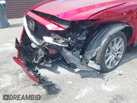 2021 Mazda CX-5 Grand Touring with VIN JM3KFADM6M1373111, listed as a IAAI auction lot 42784431 with 14,374 mi miles and . Bid and sale history available at DreamBid. Image 6.