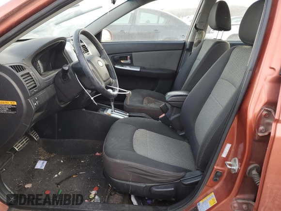2009 Kia Spectra SX with VIN KNAFE221095026589, listed as a Copart auction lot 45005514 with 203,779 mi miles and Salvage Title. Bid and sale history available at carsss.com. Image 7.