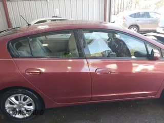 2010 Honda Insight EX z VIN JHMZE2H7XAS001280, wystawiony jako IAAI lot #41982398 z przebiegiem 142 434 mil mil oraz . Historia ofert i sprzedaży dostępna na DreamBid. Obrazek 13.