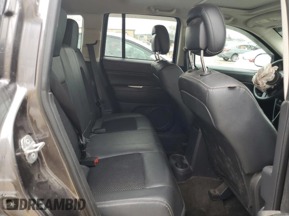 2014 Jeep Compass Latitude with VIN 1C4NJDEB4ED904731, listed as a Copart auction lot 51809165 with 104,760 mi miles and Salvage Title. Bid and sale history available at DreamBid. Image 11.