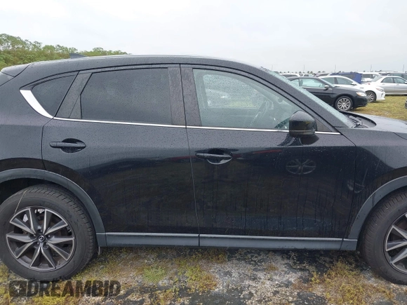 2018 Mazda CX-5 Touring with VIN JM3KFACM0J0315739, listed as a IAAI auction lot 40516262 with 60,727 mi miles. Bid and sale history available at carsss.com. Image 13.