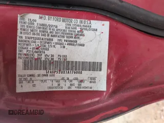 2001 Ford Taurus LX with VIN 1FAFP52UX1A176008, listed as a Copart auction lot 58983935 with 123,985 mi miles and Salvage title. Bid and sale history available at DreamBid. Image 12.