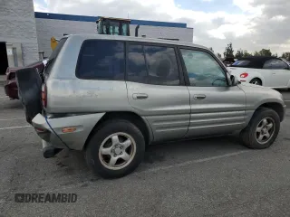 1999 Toyota RAV4 with VIN JT3GP10V0X7054819, listed as a Copart auction lot 44864015 with 140,095 mi miles and Salvage Title. Bid and sale history available at DreamBid. Image 3.