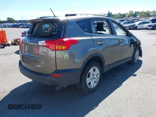 2015 Toyota RAV4 LE with VIN JTMBFREV2FD124756, listed as a IAAI auction lot 42051691 with 92,699 mi miles and . Bid and sale history available at DreamBid. Image 4.