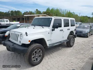 2015 Jeep Wrangler Unlimited Rubicon Hard Rock with VIN 1C4HJWFG7FL684057, listed as a IAAI auction lot 41963885 with 103,240 mi miles. Bid and sale history available at carsss.com. Image 17.
