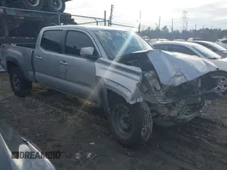 2021 Toyota Tacoma 4WD SR5 with VIN 5TFDZ5BN2MX063823, listed as a IAAI auction lot 41447098 with 52,538 mi miles. Bid and sale history available at carsss.com. Image 1.