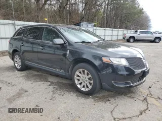 2015 Lincoln MKT with VIN 2LMHJ5NK9FBL01560, listed as a Copart auction lot 44083555 with 104,869 mi miles and Clean Title. Bid and sale history available at DreamBid. Image 4.