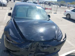 2019 Tesla Model 3 Long Range with VIN 5YJ3E1EB6KF192477, listed as a IAAI auction lot 41981600 with 62,888 mi miles. Bid and sale history available at carsss.com. Image 12.