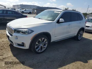 2014 BMW X5 xDrive50i z VIN 5UXKR6C55E0C03032, wystawiony jako Copart lot #57274505 z przebiegiem 107 963 mil mil oraz Czysty tytuł • Clean title. Historia ofert i sprzedaży dostępna na DreamBid. Obrazek 1.