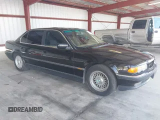 1999 BMW 7 Series 740il with VIN WBAGH8336XDP03839, listed as a IAAI auction lot 42067133 with 163,345 mi miles. Bid and sale history available at carsss.com. Image 1.